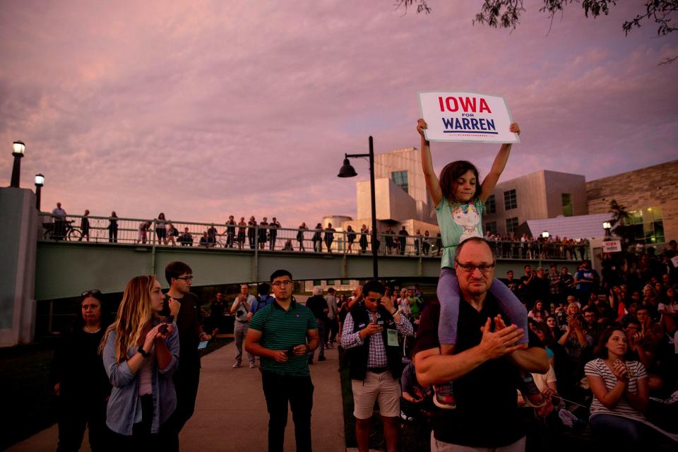 The crowd listens to U.S. Sen. Elizabeth Warren, D-Mass., speaking outside of the Iowa Memorial Union during a presidential campaign rally on Thursday, Sept. 19, 2019 on the University of Iowa campus in Iowa City.