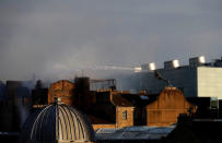 Firefighters attend to a blaze at the Mackintosh Building at the Glasgow School of Art, which is the second time in four years, Glasgow, Scotland, Britain June 16, 2018. REUTERS/Russell Cheyne?