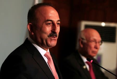 Turkish Foreign Minister Mevlut Cavusoglu speaks during a news conference with the Adviser to Pakistan's Prime Minister on National Security and Foreign Affairs, Sartaj Aziz (R) at the Foreign Ministry in Islamabad, Pakistan, August 2, 2016. REUTERS/Faisal Mahmood