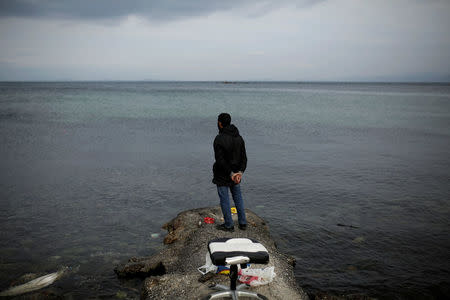 Syrian refugee Muhammad, 42, looks at the sea while fishing in the city of Mytilene, on the island of Lesbos, Greece, December 2, 2017. REUTERS/Alkis Konstantinidis
