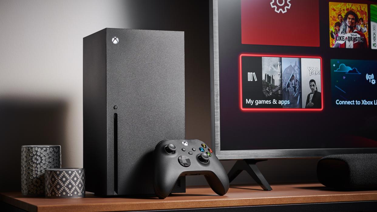  Xbox Series X console next to TV. 