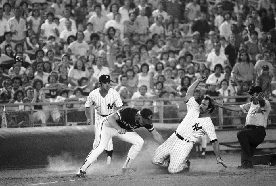 Yankees catcher Thurman Munson slides into third base against Cleveland in an undated photo.