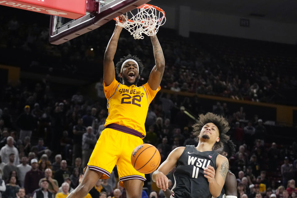 Arizona State forward Warren Washington (22) dunks against Washington State forward DJ Rodman (11) during the second half of an NCAA college basketball game in Tempe, Ariz., Thursday, Jan. 5, 2023. Arizona State won 77-71. (AP Photo/Ross D. Franklin)