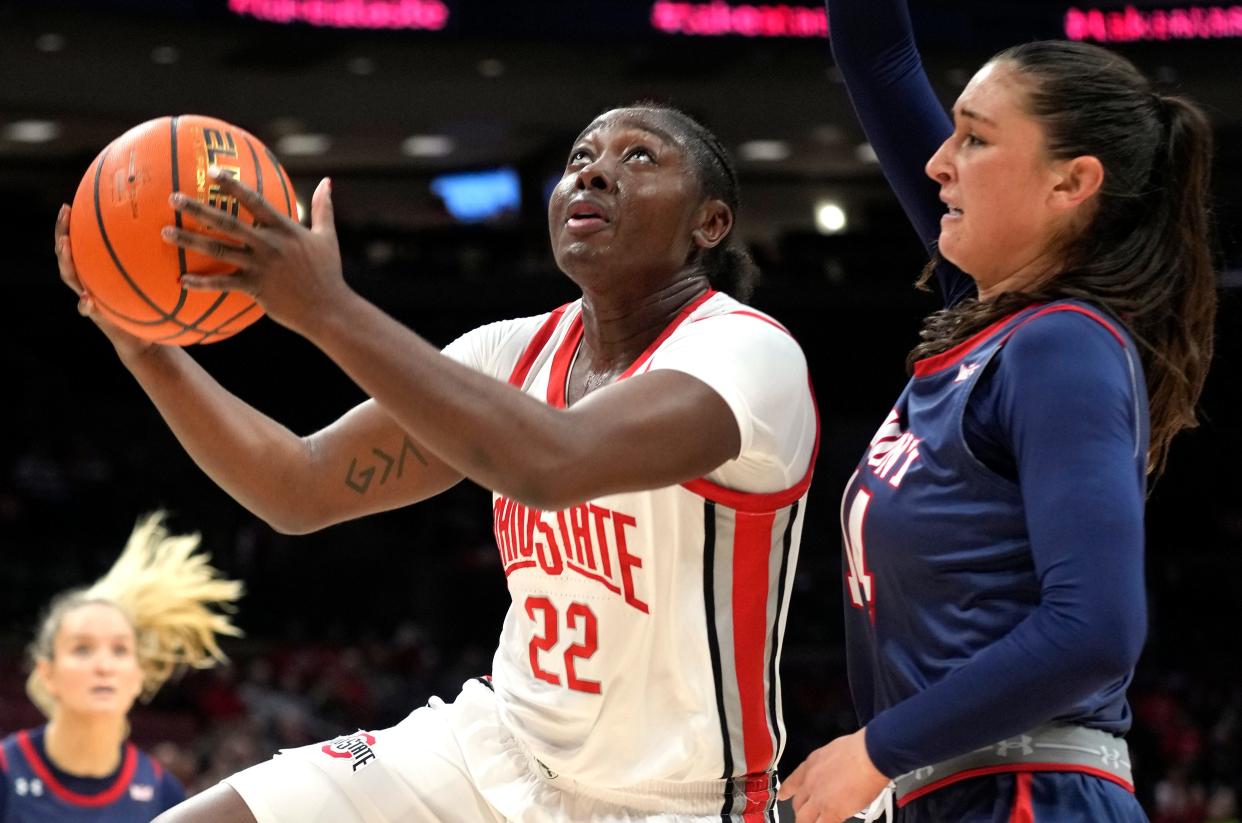 Dec 22, 2023; Columbus, OH, USA; Ohio State Buckeyes forward Eboni Walker (22) makes a two point shot guarded by Belmont Bruins forward Kendal Cheesman (14) at Value City Arena.