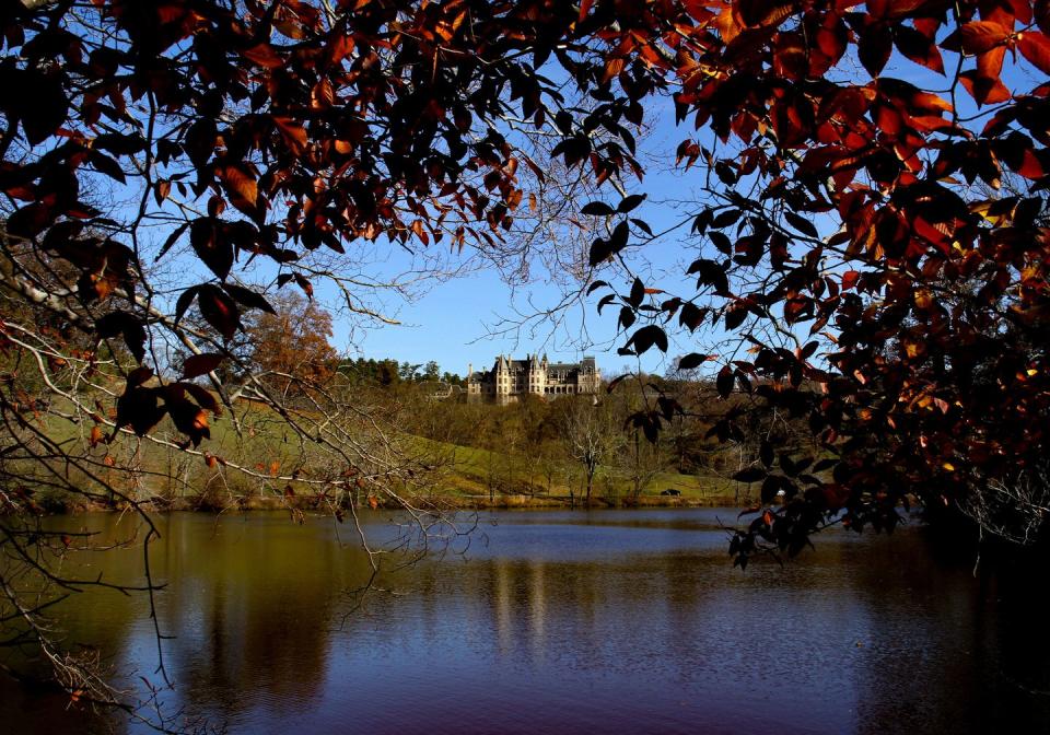 asheville, nc, united states october 31, 2010 the historic biltmore estate, largest privately owned home in the united states, seen on a hill from a nearby lake