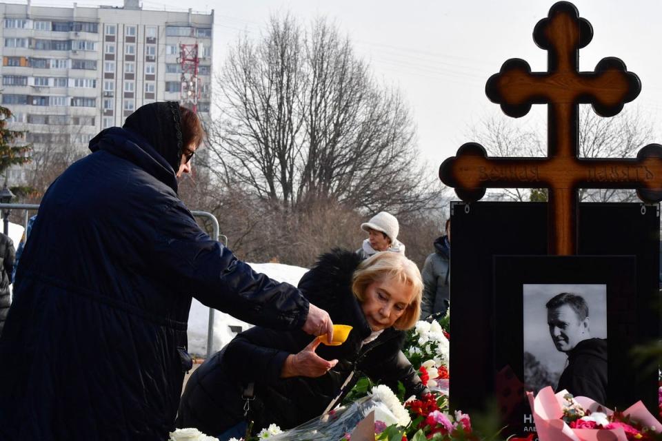 Russian opposition leader Alexei Navalny's mother, Lyudmila Navalnaya, left, and his mother-in-law Yulia at the burial site (AFP via Getty Images)