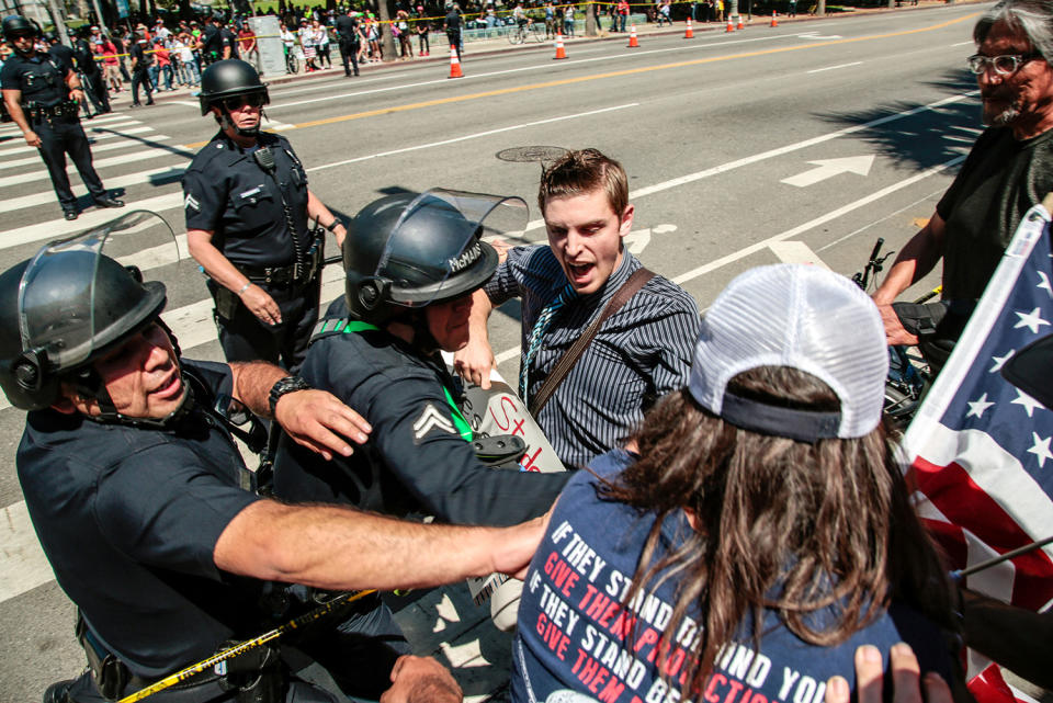 Protester pulled away from counter-protesters