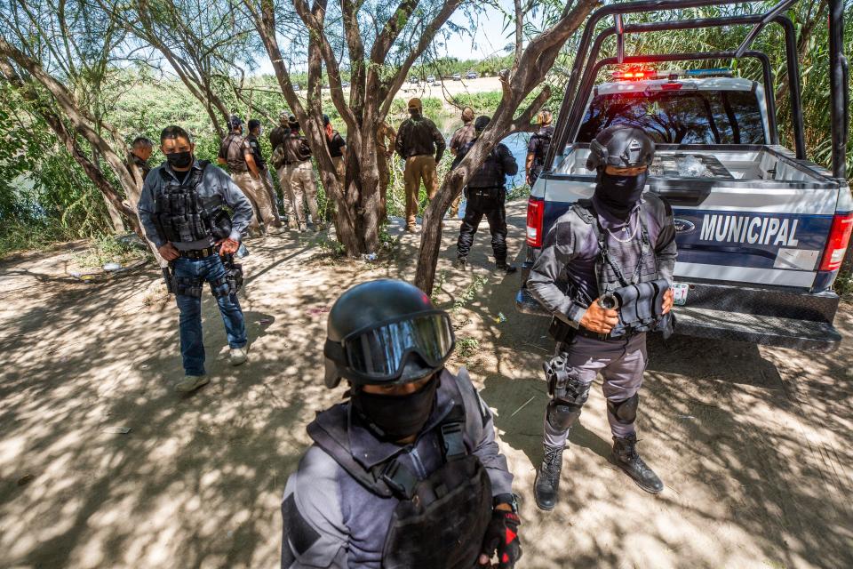 Mexican State Police close access to the Rio Grande immigration officials in Ciudad Acuña after Mexican police entered the Braulio Fernandez Park where the migrants had taken refuge on Thursday Sept. 23, 2021.