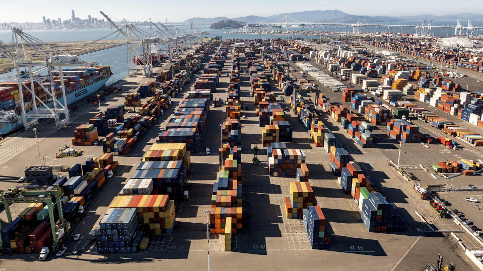 Containers line a Port of Oakland shipping terminal on Wednesday, Nov. 10, 2021, in Oakland, Calif. Intense demand for products has led to a backlog of container ships outside the nation's two largest ports along the Southern California coast. (AP Photo/Noah Berger)