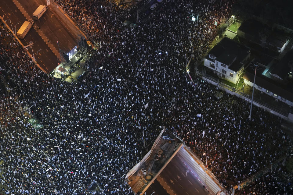 Tens of thousands of Israelis protest against plans by Prime Minister Benjamin Netanyahu's new government to overhaul the judicial system, in Tel Aviv, Israel, Saturday, March 4, 2023. (AP Photo/Tsafrir Abayov)