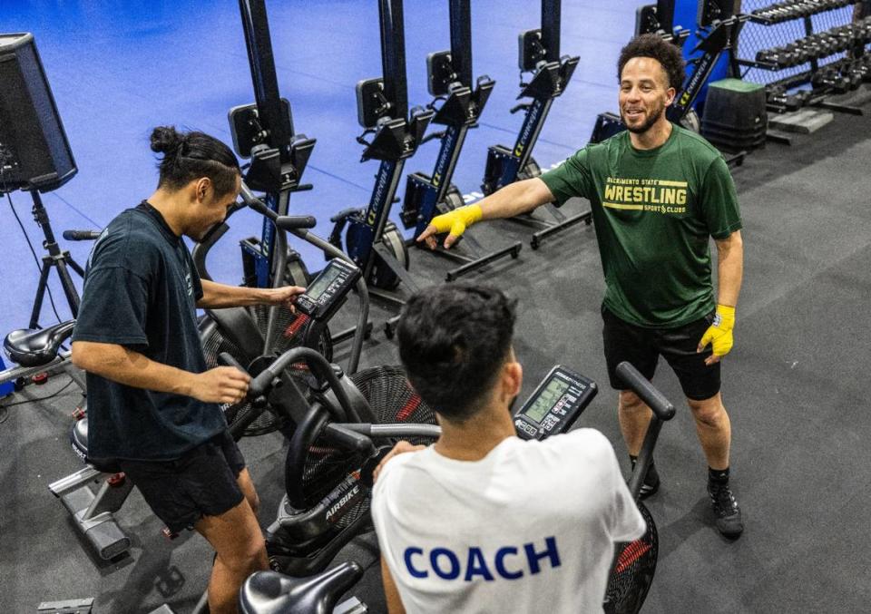 Sacramento State President Luke Wood, who is planning to bring boxing back to the university as a club sports, talks with students after a training session on Sunday, Jan. 14, 2024, at Urijah Faber’s Ultimate Fitness gym in East Sacramento.
