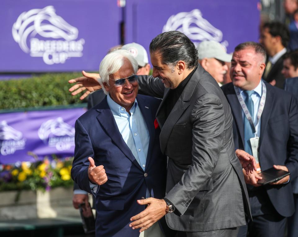 Trainer Bob Baffert and owner Amr Zedan celebrate after their horse Arabian Knight won the first race Saturday at the Breeders' Cup World Championships at Keeneland in Lexington, Ky. Nov. 5, 2022. 