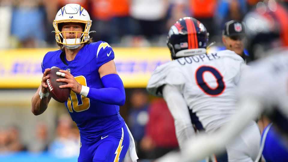 Justin Herbert looks to pass against the Denver Broncos. - Gary A. Vasquez/USA TODAY Sports/Reuters