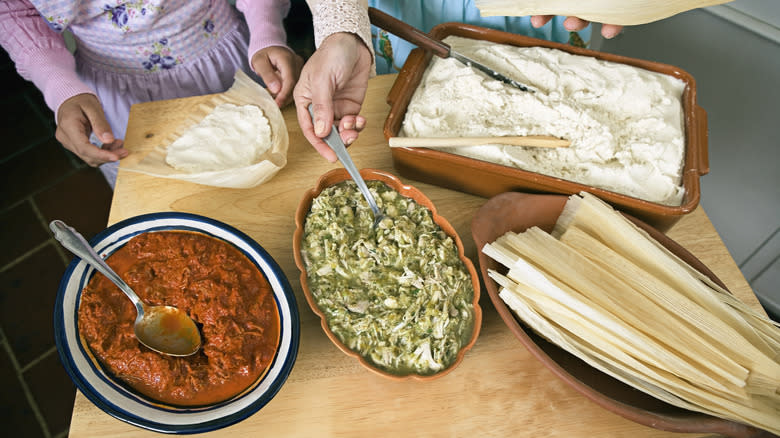 people making tamales together