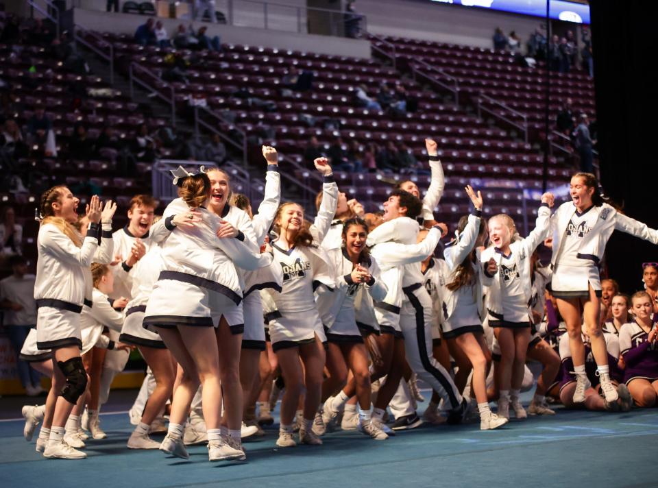 McDowell celebrates after winning the coed varsity title during Saturday's PIAA competitive spirit meet at Hershey's Giant Center. It was the second straight state title and fourth overall for the Trojans.