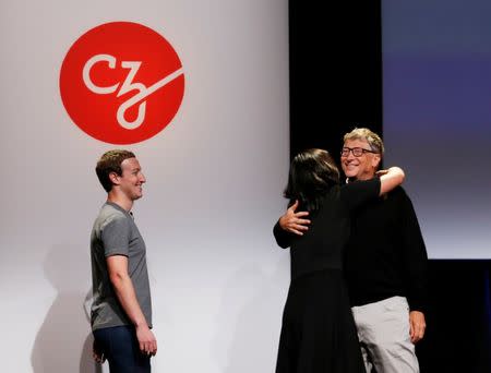 REFILE - CORRECTING TYPOPhilanthropist Bill Gates (R) embraces Priscilla Chan (2nd R) as Mark Zuckerberg looks on during an announcement of the Chan Zuckerberg Initiative to "cure, prevent or manage all disease" by the end of the century during a news conference at UCSF Mission Bay in San Francisco, California, U.S. September 21, 2016. REUTERS/Beck Diefenbach