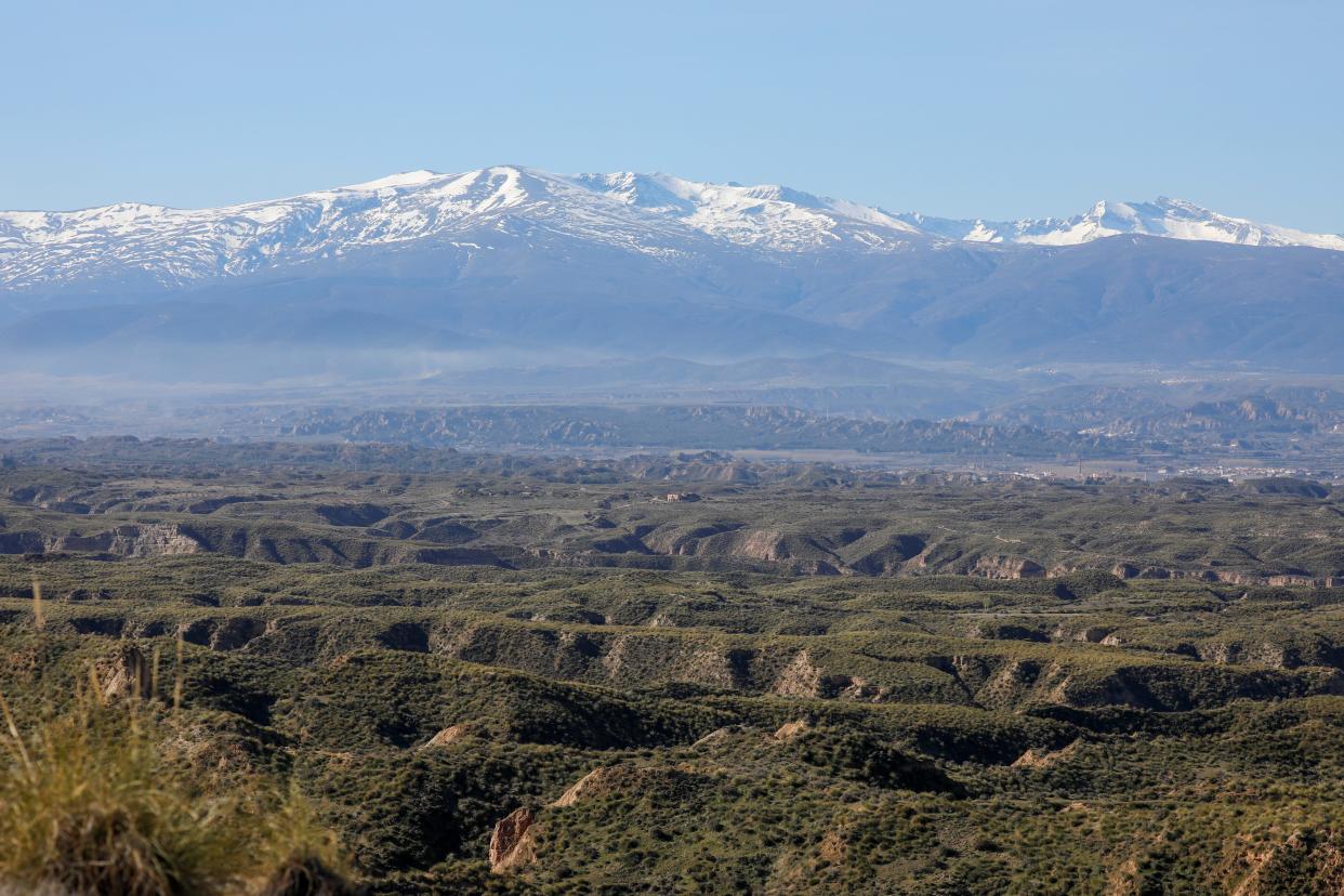 A general view shows Sierra Nevada mountain and eroded land with desert vegetation in Hernan Valle, near Granada, Spain, March 10, 2020.