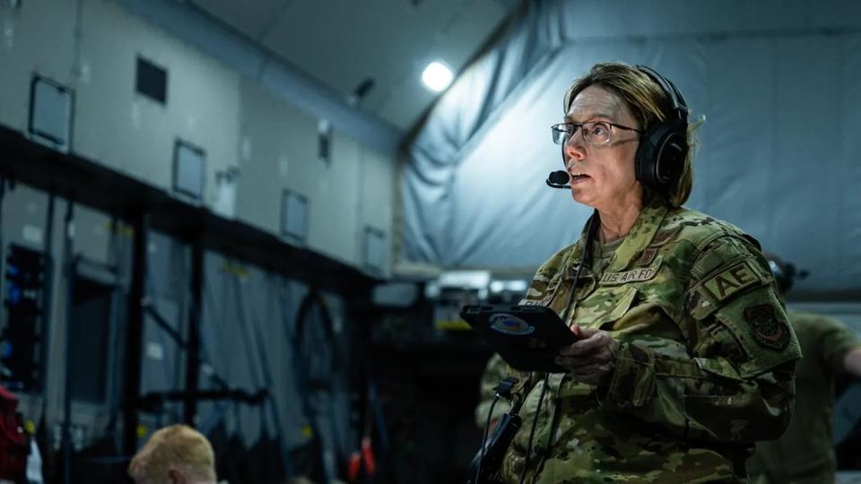 Lt. Col. Stephanie Ellenburg, 375th Aeromedical Evacuation Squadron commander, speaks to the AE crew during joint medical training on a Royal Air Force A400M Atlas over the Indo-Pacific region July 14 during Mobility Guardian 2023. (Staff Sgt. Devin Rumbaugh/Air Force)
