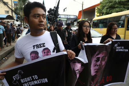 FILE PHOTO: Youth activist Maung Saung Kha (L) leads a march for press freedom in Yangon, Myanmar, September 1, 2018. Picture taken September 1, 2018. REUTERS/Ann Wang