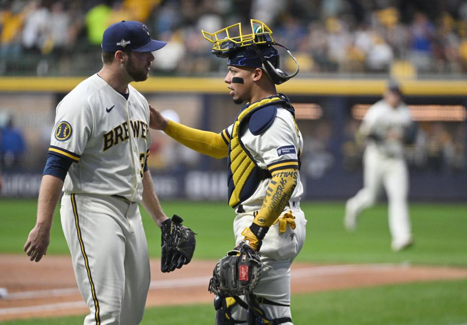 Oct 3, 2023; Milwaukee, Wisconsin, USA; Milwaukee Brewers starting pitcher Corbin Burnes (39) talks with Milwaukee Brewers catcher William Contreras (24) after the first inning against the Arizona Diamondbacks during game one of the Wildcard series for the 2023 MLB playoffs at American Family Field. Mandatory Credit: Michael McLoone-USA TODAY Sports