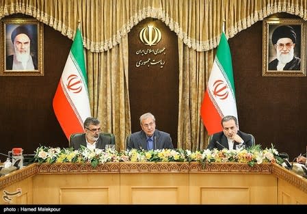 Abbas Araqchi, Iranian deputy foreign minister for political affairs, Behrouz Kamalvandi, Iran's Atomic Energy Organization spokesman and Iran's government spokesman Ali Rabiei attend a news conferenece in Tehran