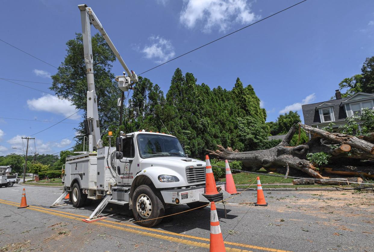 Carolina Power helps restore power on North Street in Anderson, which affected several homes near Linley Park as a result of the May 9 storm in Anderson County.