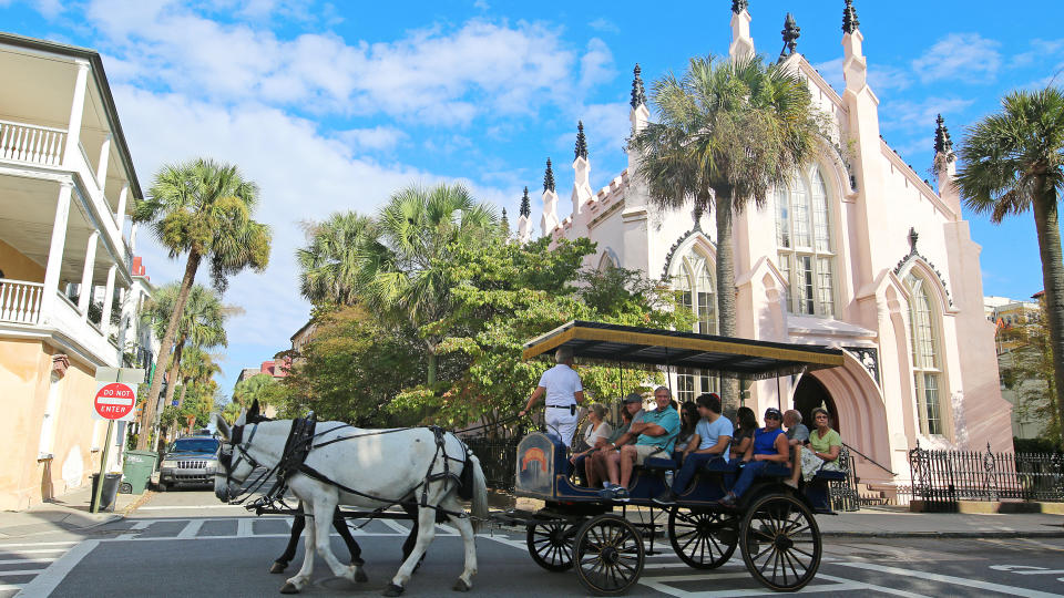 Charleston, South Carolina USA - October 12, 2015Horse Drawn Carriage Ride by French Huguenot Church.