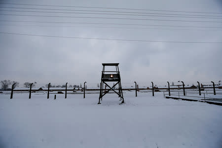 FILE PHOTO: A guard tower is seen at the former German Nazi concentration and extermination camp Auschwitz-Birkenau near Oswiecim January 26, 2015. REUTERS/Laszlo Balogh/File Photo