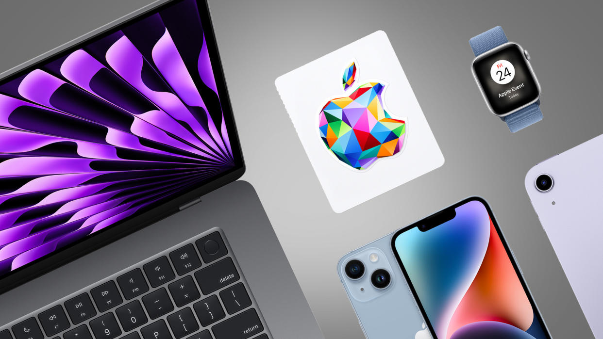  A MacBook, iPhone, Apple Watch and Apple gift box on a grey background. 