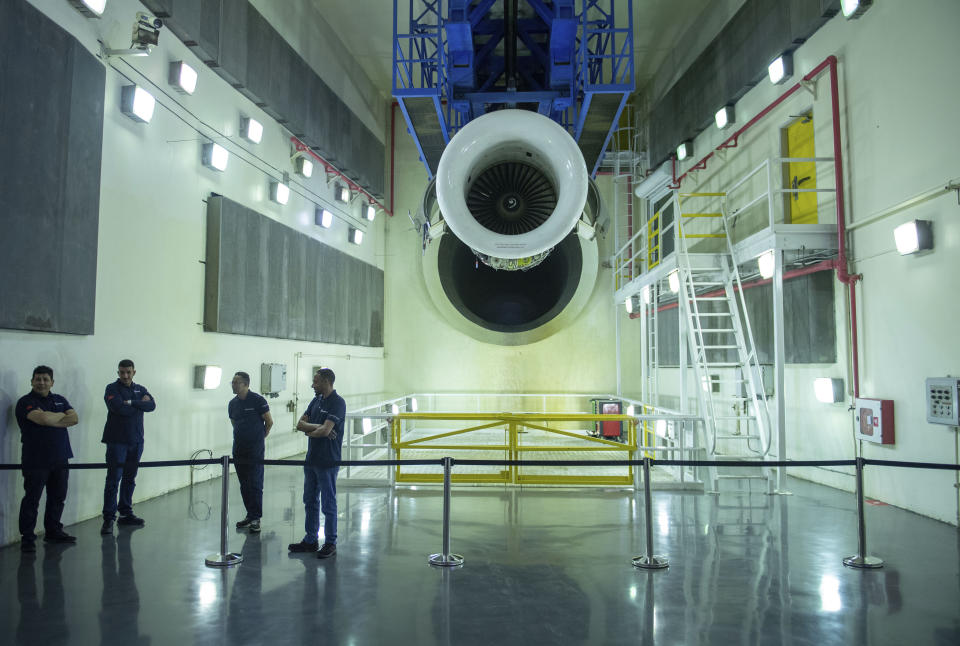 Engineers and workers stand inside Safran Aircraft Engines repair plant outside of Casablanca, Morocco, Thursday, April 18, 2024. Moroccan officials are aiming to turn the country into an aerospace hub, luring investors and manufacturers who have aimed to spread out their supply chains and find willing workers since the COVID-19 pandemic. (AP Photo)