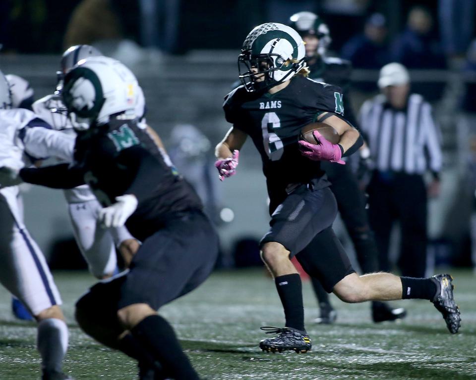 Marshfield's Davin True cuts inside before scoring the touchdown to give Marshfield the 41-20 lead during third quarter action of their game in the Sweet 16 round of the Division 2 state tournament at Marshfield High on Friday, Nov. 3, 2023. Marshfield would go on to win 55-34.