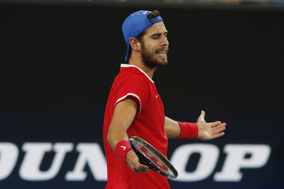 Karen Khachanov of Russia reacts after playing a shot against Dusan Lajovic of Serbia during their ATP Cup semifinal tennis match in Sydney, Saturday, Jan. 11, 2020. (AP Photo/Steve Christo)