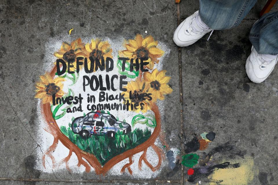 Defund the police painting city hall.JPG