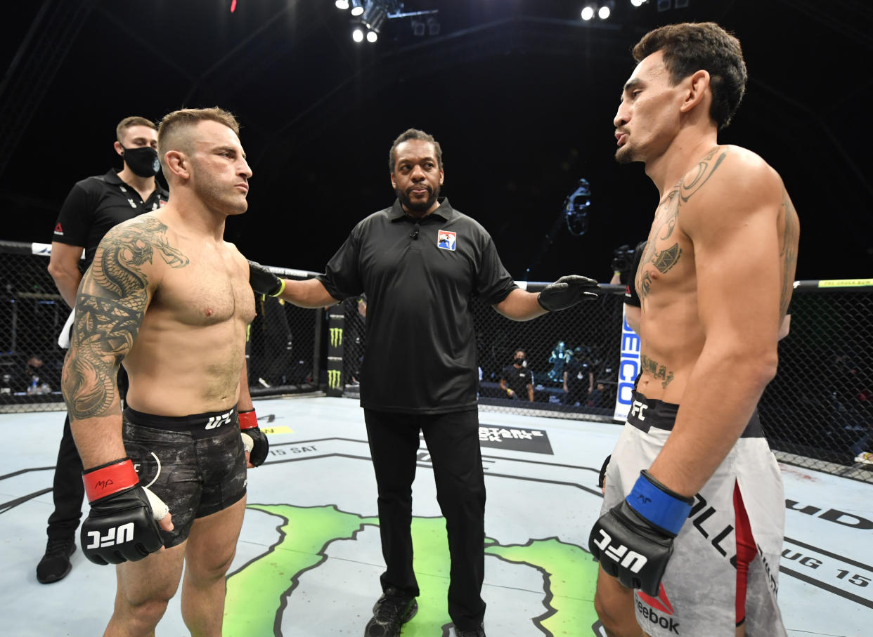 ABU DHABI, UNITED ARAB EMIRATES - JULY 12: (L-R) Opponents Alexander Volkanovski of Australia and Max Holloway face off prior to their UFC featherweight championship fight during the UFC 251 event at Flash Forum on UFC Fight Island on July 12, 2020 on Yas Island, Abu Dhabi, United Arab Emirates. (Photo by Jeff Bottari/Zuffa LLC)