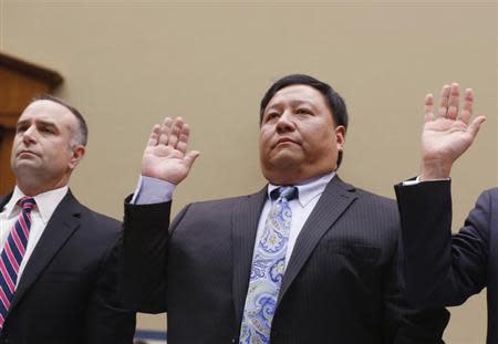 Deputy Director of the Office of Information Services Centers for Medicare and Medicaid Services Henry Chao swears in before testifying before the House Oversight and Government Reform Committee hearing on "ObamaCare" implementation on Capitol Hill in Washington, November 13, 2013. REUTERS/Larry Downing