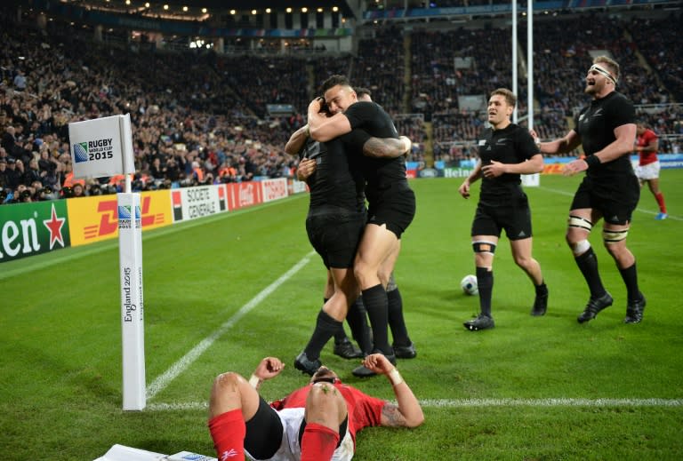 New Zealand's centre Ma'a Nonu (L) celebrates with teammates after scoring a try during their Rugby World Cup Pool C match against Tonga, at St James' Park in Newcastle-upon-Tyne, on October 9, 2015