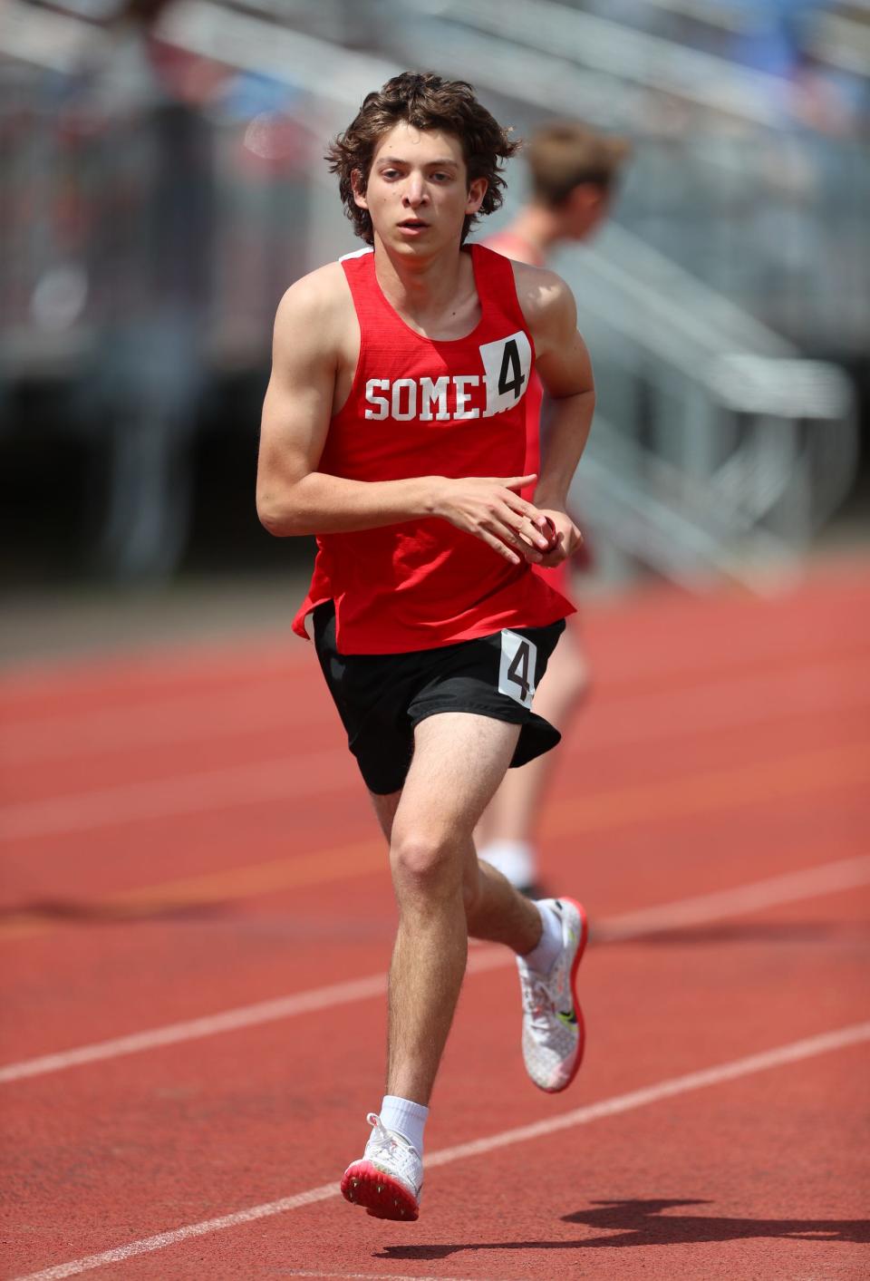 Somers junior Alex Dunn competes in the boys 1,600 sprint medley relay during day 2 of the Red Raider Relays at North Rockland High School in Thiells on Saturday, April 23, 2022.