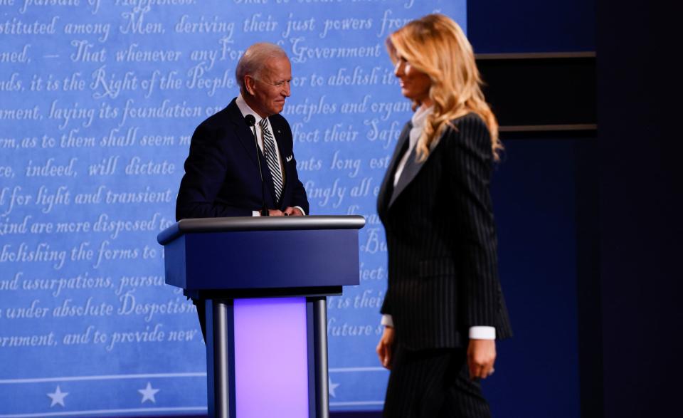 First lady Melania Trump walks past Democratic presidential nominee Joe Biden at the conclusion of the first 2020 presidential campaign debate between U.S. President Donald Trump and Democratic presidential nominee Joe Biden held on the campus of the Cleveland Clinic at Case Western Reserve University in Cleveland, Ohio, U.S., September 29, 2020.