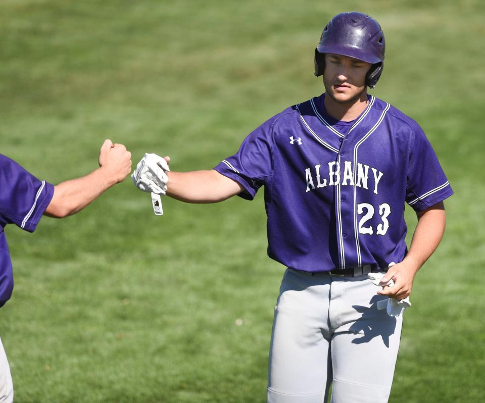 Albany junior Brady Goebel walks off the field in the Class 2A state quarterfinals against Aitkin Tuesday, June 15, 2021, at Dick Putz Field in St. Cloud. 