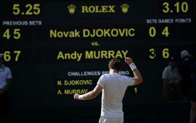 Andy Murray throws his fist in the air to celebrate his Wimbledon triumph