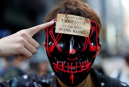 Masked anti-government protesters gather in Central Hong Kong