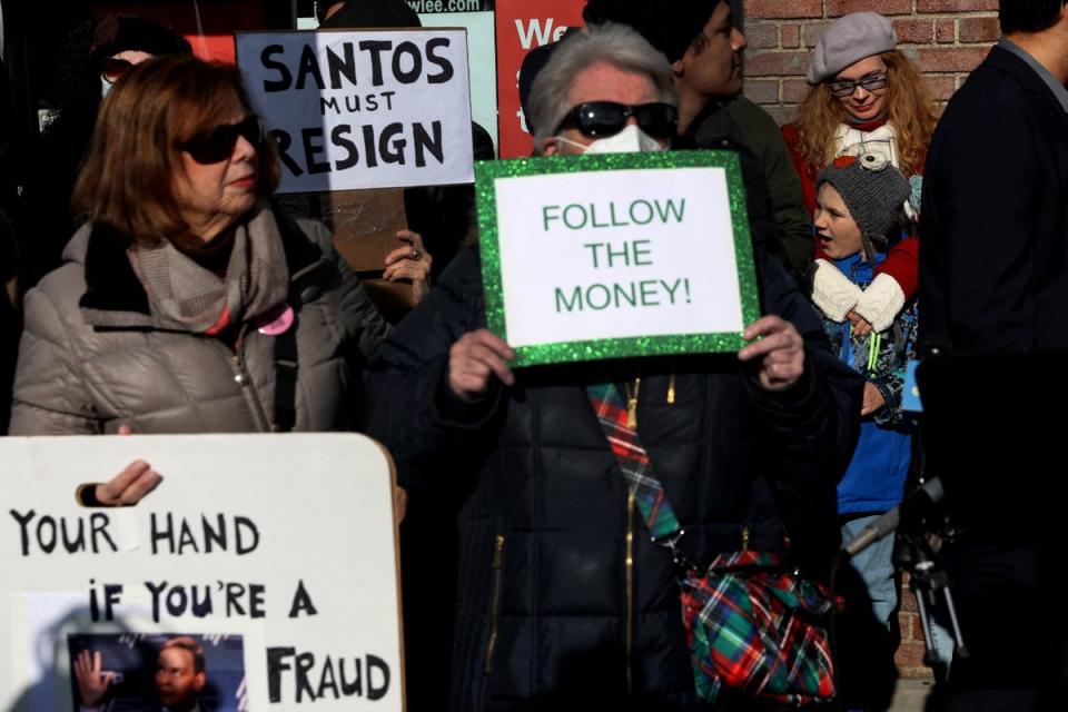People demonstrate against newly elected freshman Rep. George Santos (R-NY), who is facing a scandal over his resume and claims he made on the campaign trail, outside a future campaign office in the Queens borough of New York City, U.S., January 7, 2023. (REUTERS/Shannon Stapleton)