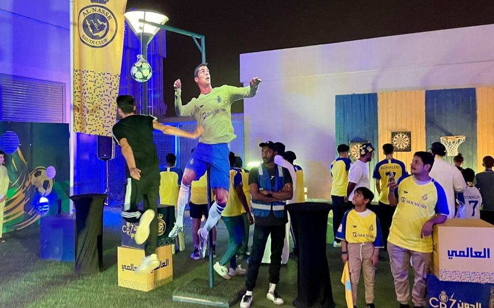 Al Nassr fans try to emulate Cristiano Ronaldo - Sam Farley for The Telegraph