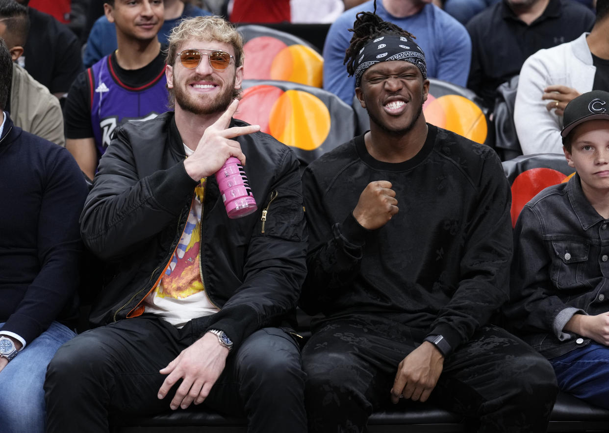 TORONTO, ON - OCTOBER 28: Logan Paul and KSI pose courtside during break in play between the Toronto Raptors and the Philadelphia 76ers in their basketball game at the Scotiabank Arena on October 28, 2023 in Toronto, Ontario, Canada. NOTE TO USER: User expressly acknowledges and agrees that, by downloading and/or using this Photograph, user is consenting to the terms and conditions of the Getty Images License Agreement. (Photo by Mark Blinch/Getty Images)