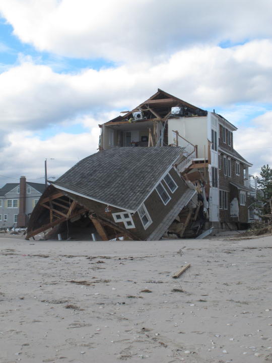 This Oct. 31, 2012 file photo shows a home in Mantoloking N.J.that was destroyed by Superstorm Sandy, which had hit two days earlier. On the 10th anniversary of the storm, government officials and residents say much has been done to protect against the next storm, but caution that much more still needs to be done to protect against future storms. (AP Photo/Wayne Parry)