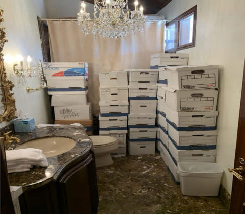 This image, contained in the indictment against former President Donald Trump, shows boxes of records stored in a bathroom and shower in the Lake Room at Trump&#39;s Mar-a-Lago estate in Palm Beach, Fla. Trump is facing 37 felony charges related to the mishandling of classified documents according to an indictment unsealed Friday, June 9, 2023. (Justice Department via AP) (Justice Dept. via AP)