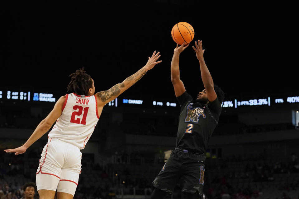 Memphis guard Alex Lomax (2) shoots against Houston guard Emanuel Sharp (21) during the first half in the finals of the American Athletic Conference Tournament, Sunday, March 12, 2023, in in Fort Worth, Texas. (AP Photo/LM Otero)