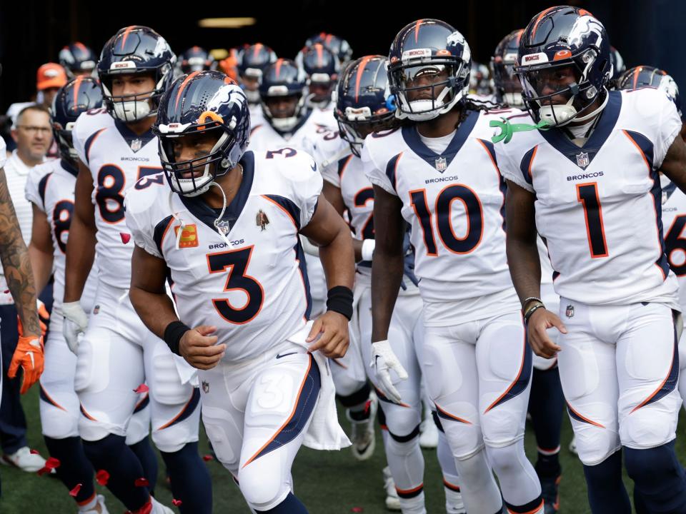 Russell Wilson leads the Broncos out for a game against the Seattle Seahawks.