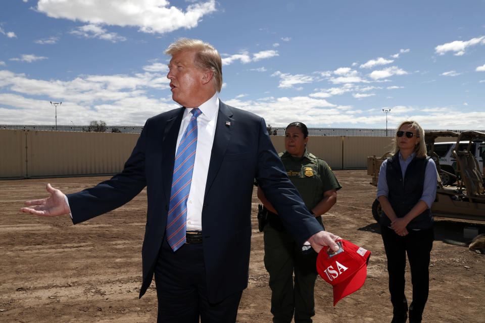 President Trump visits a new section of the border wall with Mexico in Calexico, Calif., on Friday. (AP Photo/Jacquelyn Martin)