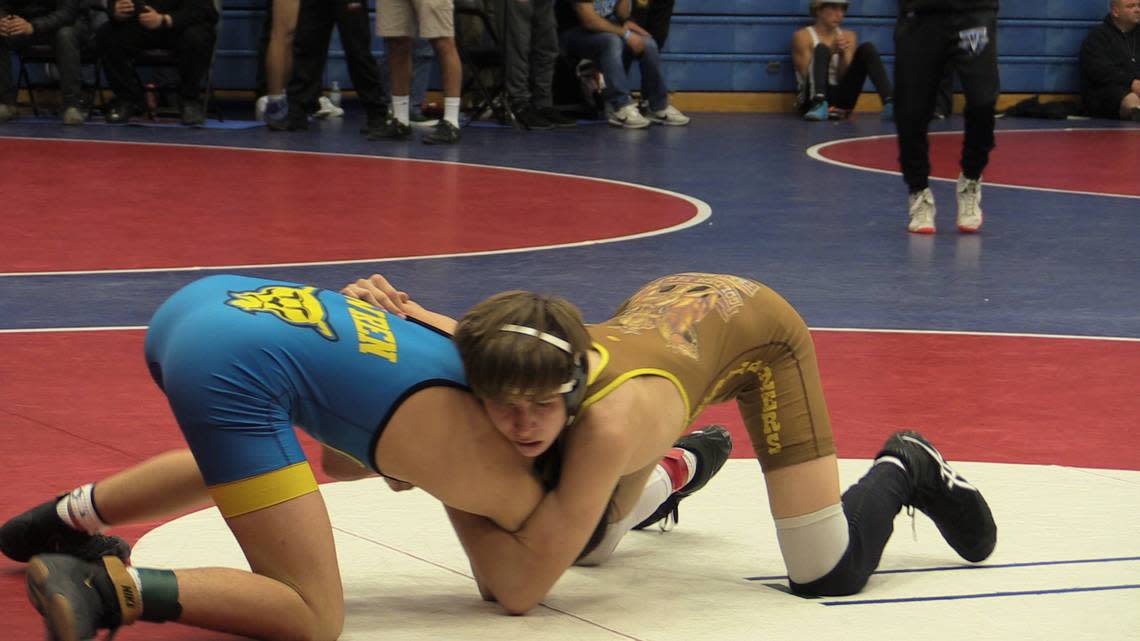 Caleb Rivas of Golden West, right, battles Jadyn Wren of Clovis, right in 115s at the Central Section Masters on Friday, Feb. 17, 2023.